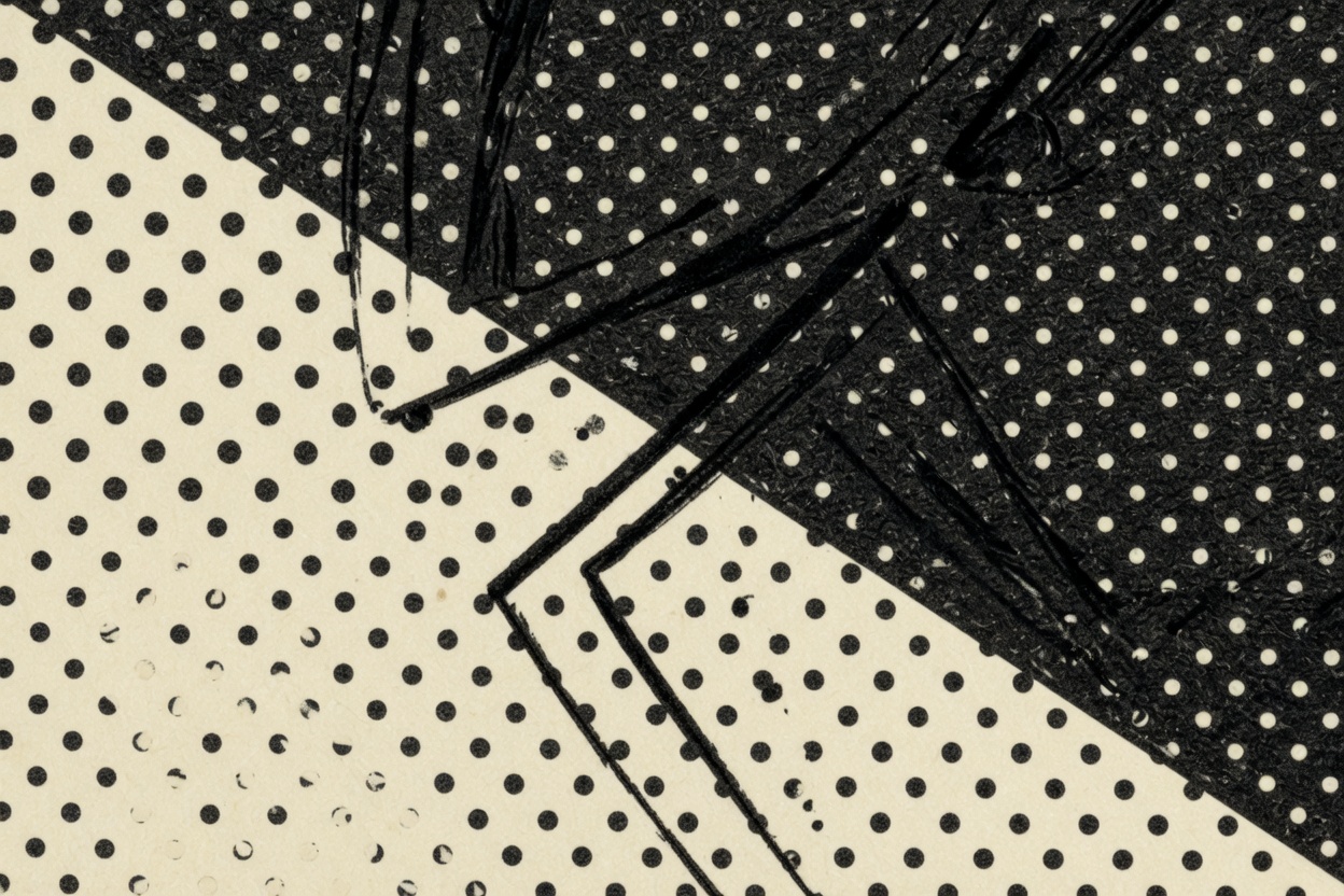 Close view of printed screentone: a dense field of dots meeting a lighter field along a sharp edge, with ink lines crossing both.